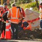 Workers assess the scene were a Chorus contractor received an electric shock after striking an...