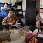 WORST FLAT: Sam Coombs (21), Josh Packer (20) and Jamie Lockyer (19) sit among the filth in the...