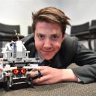 Year 12 Bayfield High School pupil Braden Smitheram on the floor with the competition robot he...