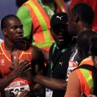 Yohan Blake (L) shakes hands with Usain Bolt after the men's 200m final at the Jamaican Olympic...