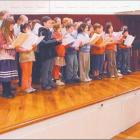 Young voices: Choir master David Burchell puts the children’s chorus through its paces during...