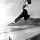 Yvette Williams practises her technique under the watchful eye of coach Jim Bellwood at the St...