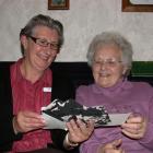 Yvonne Plant (left) and Audrey Couper enjoy looking at old photographs as they reminisce about...