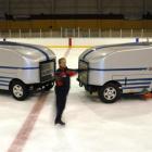 Dunedin ice skating coach Fanis Shakirzianau has a spin in front of the two resurfacing machines...