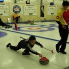 Zang Jialiang, of China, shows his technique during the Pacific Curling Championships at the...