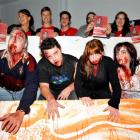 Zombies (from left) Andrew Moar, Corey Haley, Abigail Pigden and Jemima Pigden emerge from a...