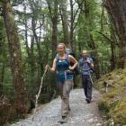 Zosha Hummer and Matt Schoonmaker-Gates, of California, nearing the end of the Routeburn Track,...