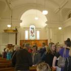 Columba Presbyterian Church parishioners exchange stories and talk of their feelings about the...