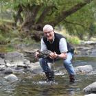 David Blair shows what clean water looks like at the Waitati Stream yesterday. Photos by Peter...