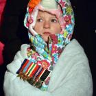 Erika Reilly, of Dunedin, wearing her great-grandfather’s medals, listens as commemorations take...