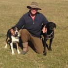 Farmer Boyd Tisdall and two of his dogs. Photo supplied.