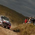 Hayden Paddon and John Kennard are pictured competing in the often rutted, sandy roads of Rally...