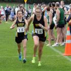 Hill City-University runner Shireen Crumpton (left) tags team-mate Bella Bloomfield during  the...