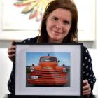Jen Smith with a work from her exhibition. Photo: Gregor Richardson