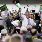 Members of the impeachment committee celebrate after voting on the impeachment of Brazilian...