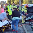 Members of the public assist emergency service staff at the scene. Photo by Gerard O'Brien.