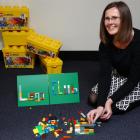 Mosgiel library assistant Lauryn Urquhart-Eaton demonstrates her construction prowess ahead of...