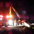 A rental car is pulled from a steep bank on the Devil's Staircase along State Highway 6, south of...