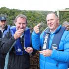 Sanfords southern aquaculture manager Tommy Foggo (left) and Prime Minister John Key sample...