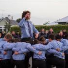 South Otago High School pupil Josh Hill leads his first XV rugby teammates in a haka at the Anzac...