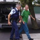 Christopher Daniel Hubbard, also known as Christopher Shaw, is escorted into  the Oamaru District...