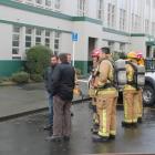 Southern Institute of Technology facilities manager Neil Smith (back to camera) talks to...