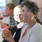 Louise McDougall enjoys a cupcake at the Pink Ribbon Breakfast yesterday morning. PHOTO: HAMISH...