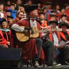 Newly capped doctor of musical arts John Egenes performs his song Up for Air during the first of...