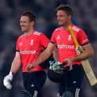 England’s Eoin Morgan (L) and Jos Buttler leave the field after the match. Photo Reuters