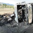 A camper van destroyed by fire after it overturned on the Omarama side of the  Lindis Pass...