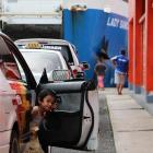 In the queue for the vehicle and passenger ferry that plies Apolima Strait between Upolu and...