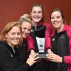 Netball South coach Lauren Piebenga (second from left) with South players (from left) Bridget...