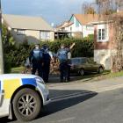 Police speak to two people after an apparent home invasion in Green Island left a man with...