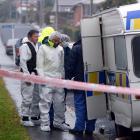 Scene of crime officers prepare to enter the Church St property yesterday. Photo by Gerard O'Brien.