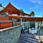 The house looking over the Frankton Arm features an intricate multi-level steel structure to...