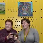 Anne Turner (left) and Angela Spears at the Stan Turner Memorial Art Auction at the University of...