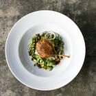 Confit duck with kohlrabi, capers and watercress.