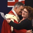 Joanne Smith hugs Dunedin Mayor Dave Cull at a citizenship ceremony at the Clifford Skeggs...