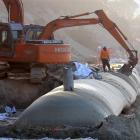 Completion of the laying of sand sausages at Ocean Beach at St Clair has been delayed after...
