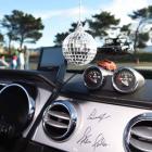 A disco globe and signatures from famous American race car driver Parnelli Jones and high...