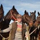 Horsewoman Genevieve Crawford is surrounded by racehorses who could be part of her rehoming...