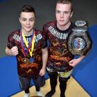 Kasib (left) and Shem Murdoch with their spoils from deeds in combat sports. Photo by Gregor...