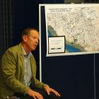 Medical officer of health Dr Derek Bell answers a question at a meeting in Frankton last night...