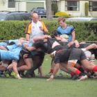 Referee Nick Webster stands by as a scrum is set during the Otago First XV semifinal between...