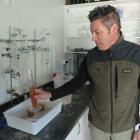 Renzo Mino, of Kurow Estate, checks a sample of experimental orange wine. Photos by Shannon Gillies.