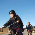 Cycling home from Holy Family Catholic School  yesterday are  Amelia Mitchell (12, front) and...