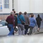Workers leave the Cadbury factory in Dunedin after a meeting over future job cuts. Photo by Craig...