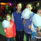 Candy floss was on the menu at the Blossom Festival Mardi Gras for Chatto Creek girls (from left)...