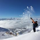 A snowboarder flicks up powder snow at the Cardrona Alpine Resort earlier this season. Photo:...