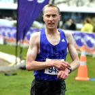 Sam Wreford crosses the finish line to win the open men’s half marathon yesterday. Photo: Gregor...